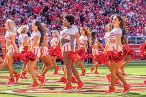 Della Anjeh ’16 seen in the center, cheerleading for the San Francisco 49ers.