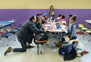 Dorsey visits with children at Greensboro Elementary School during an after-school program.