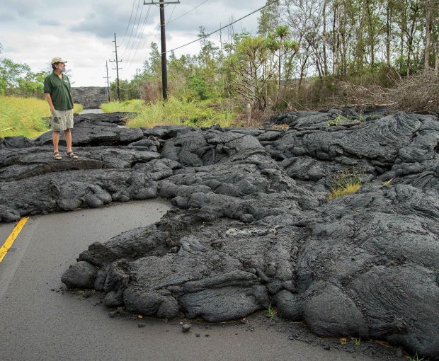 Jim Kauahikaua ’73 stands on one of a series of lava flows