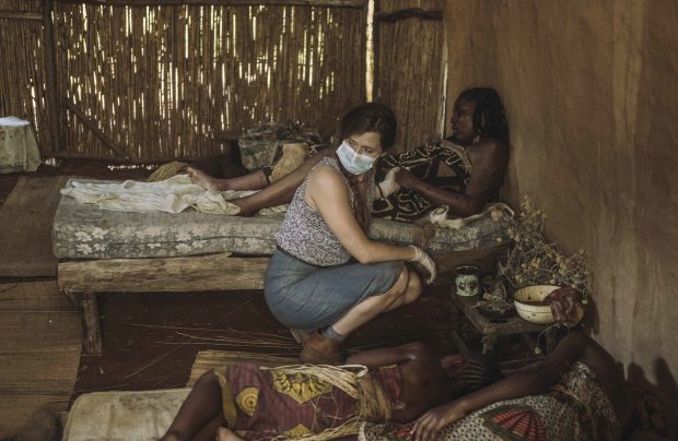 In an episode of The Hot Zone, a character played by Grace Gummer (center) tends to a hut of Ebola victims, including a pregnant woman. —Photo by National Geographic/Casey Crafford