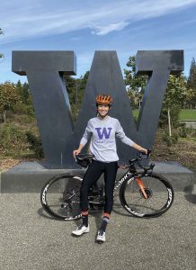 Katie Hall poses with her bike on the campus of the University of Washington.