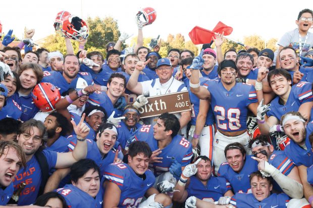 Pomona-Pitzer Football team seen celebrating after winning 2022 Sixth st. Rivalry game