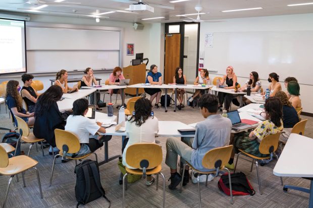 Associate Professor of Gender and Women’s Studies Aimee Bahng, right of the podium, leads a discussion in her Race, Gender, and the Environment class.