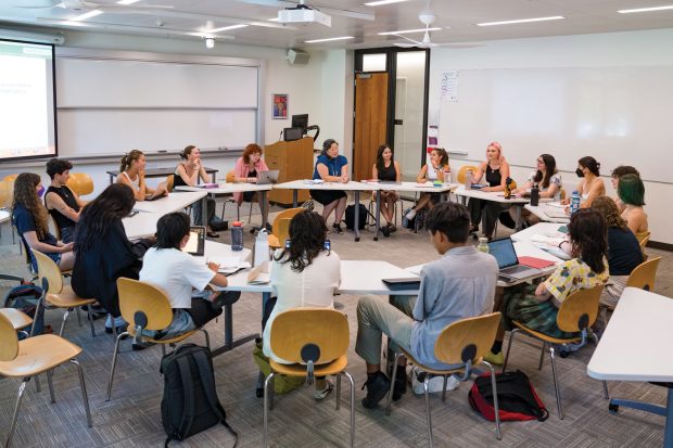 Associate Professor of Gender and Women’s Studies Aimee Bahng, right of the podium, leads a discussion in her Race, Gender and the Environment class.