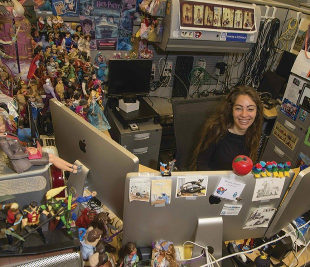 Photo of Melanie Sisneros ’94 at her workstation