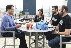 Justin Fenchel and his partners meeting at a table with Mark Cuban