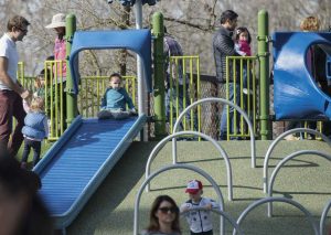 Families take advantage of a beautiful day at the Magical Bridge in Palo Alto. 