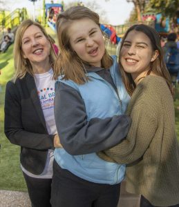 Olenka Villarreal ’85 is joined at the playground by her two daughters, Ava (center) and Emma.