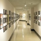 basement of Bridges Auditorium: a long, meandering hallway lined with photos and posters