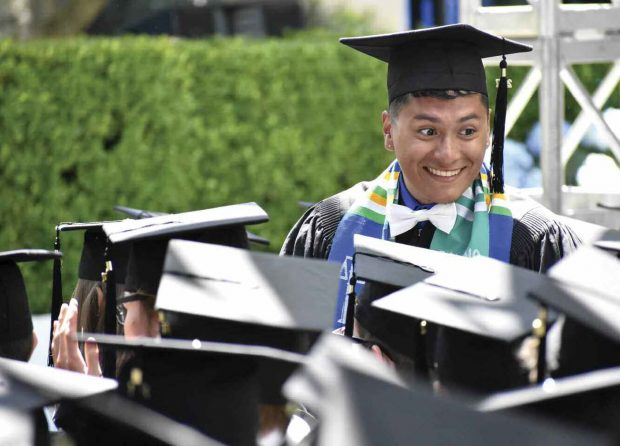 Rodrigo De Leon ’17 awaits his turn to pick up his diploma.