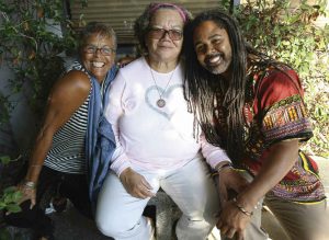 Back among familiy and friends, Bridges is joined by her cousin and fellow church member Jason Mitchel (right) and Thelma Chichester, chief administrative officer at Agape.