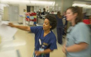 Toles makes a teaching point with medical student Samantha Kerns.