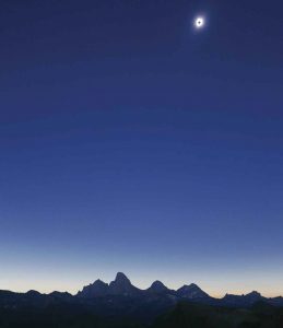 The eclipse reaches totality above the Grand Teton Mountains. Photo by Robert Gaines