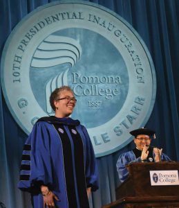 Chair of the Board Samuel D. Glick ’04 applauds after the completion of Starr’s official installation as Pomona’s 10th president.