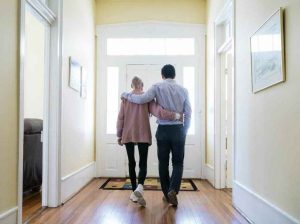 Fellow Kevin Wang, right, offers support to resident Sylvia Deason at the farmhouse.