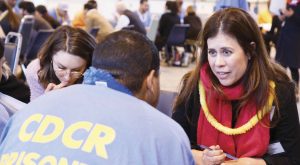 Another volunteer offering feedback to an EIT at a California prison.