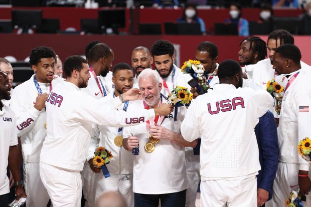 The USA Men’s National Team present Head Coach Gregg Popovich with the gold medal after winning the Gold Medal Game of the 2020 Tokyo Olympics.