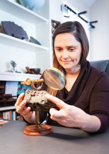 Laura Kerber inspecting mineral specimen