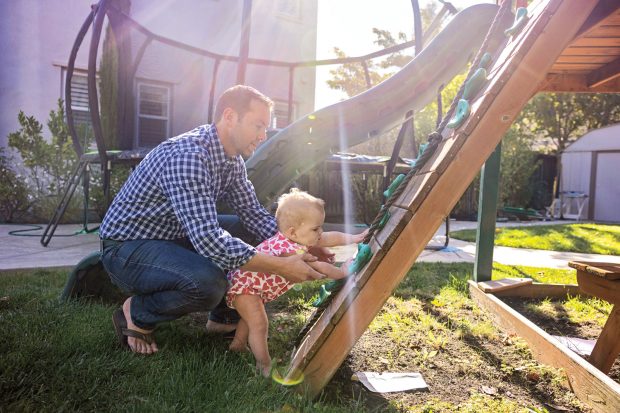 Zach Landman with daughter playing outside