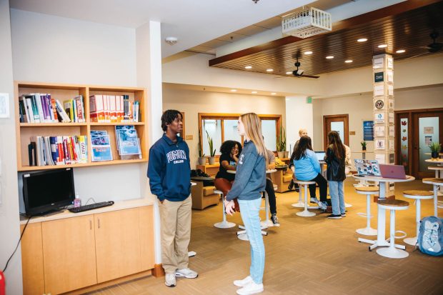 Sebastian Fish Mathurin ’26 and Katie Stuart ’25 catch up in the Career Development Office. 