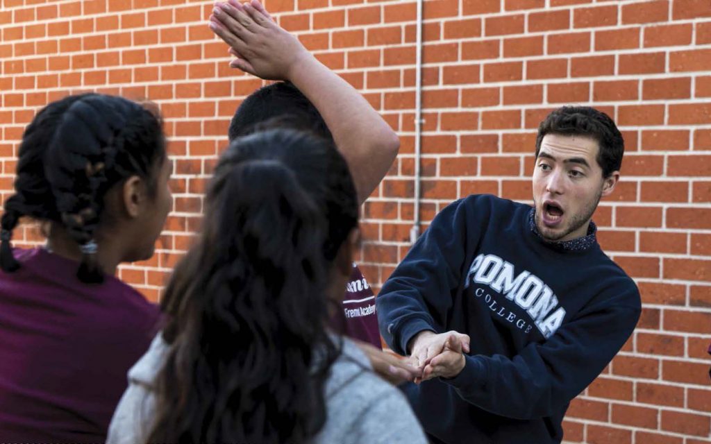 Danny DeBare ’22 engages in a community-building exercise with Fremont Academy students.