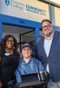 Assistant Director of the Draper Center Rita Shaw, left, Ed Tessier ’91 and Director of the Draper Center Sefa Aina at the opening.