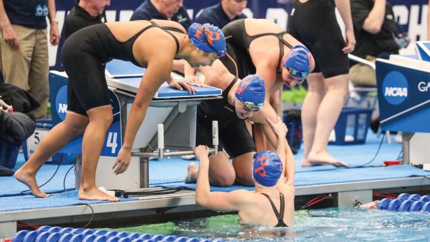 200 freestyle relay champions, from left: Sabrina Wang ’26,Alexandra Turvey ’24, Francesca Coppo ’27 (out of pool) with Valerie Mello PZ ’25 in the water.