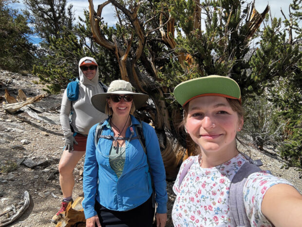 Lynn Robinson, Nikki Moore and Ruth Vesta-June Gale ’25 at the Ancient Bristlecone Pine Forest in the White Mountains to see Methuselah, confirmed to be the oldest tree in the world (4,856 years and counting...)