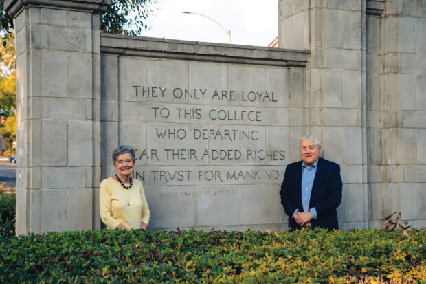 Paul and Flo Eckstein in front of the Pomona College Gate