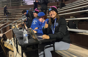 Pomona alum Ali Bennett in the stands