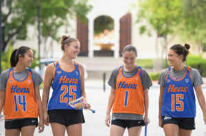 A group of women athletes smiling