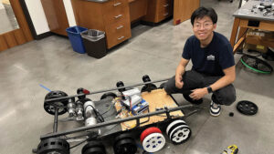 Photo of a man with a robot car