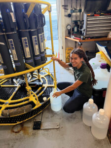 Student working on science project aboard a research vessel