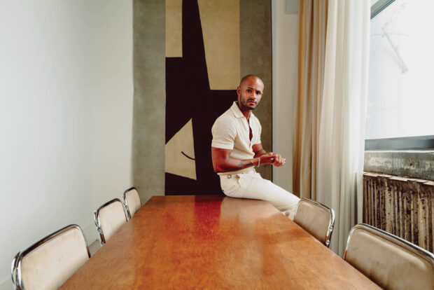 Portrait of a man sitting on a table