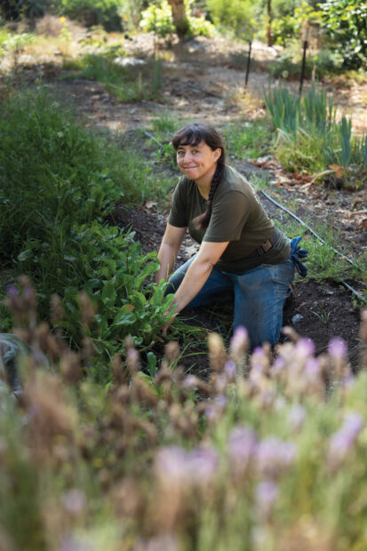 Jillian Gomez gardening at Pomona's organic farm