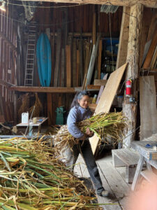 Woman carrying bales of wild garlic